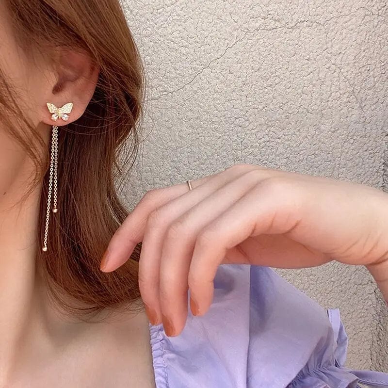 Gold butterfly drop earrings with chains